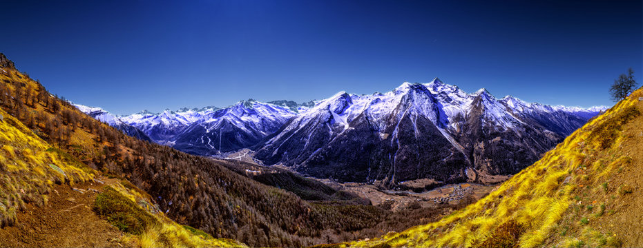 Sping panorma view of the alpine valley in a sunny shiny day