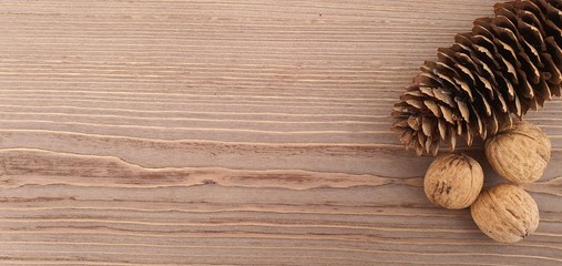 pine cones on wooden background, wooden table