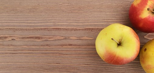 red apples on wooden table, background with apples, fruits