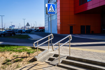 Metal handrail near the pedestrian crossing over the road