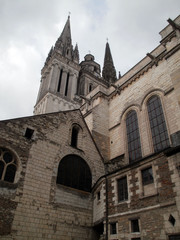 Fototapeta na wymiar Angers, France - March 15th 2013 : View of the gothic cathedral Saint-Maurice of Angers from Montée Saint-Maurice. The edifice was built between the 12th and the 13th centuries.