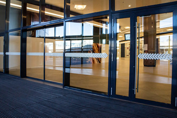 Glass doors in a mall without people. Moscow, Russia - April 14 2020