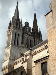 Fototapeta premium Angers, France - March 15th 2013 : View of the gothic cathedral Saint-Maurice of Angers from Montée Saint-Maurice. The edifice was built between the 12th and the 13th centuries.
