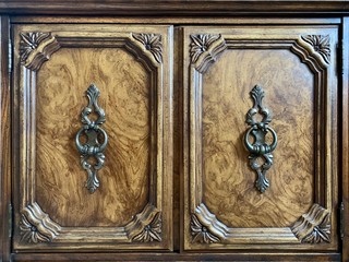 Background texture: antique bedside table with decorative handles. The doors of the old chest of...
