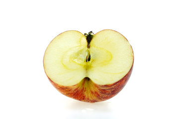 Red apples that are cut into pieces placed on a white background, taken with a macro lens
