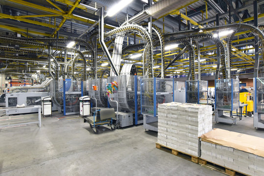 modern machines for transportation in a large print shop for production of newspapers & magazines