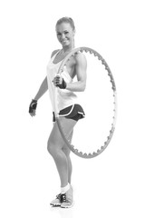 young sporty woman with hula hoop