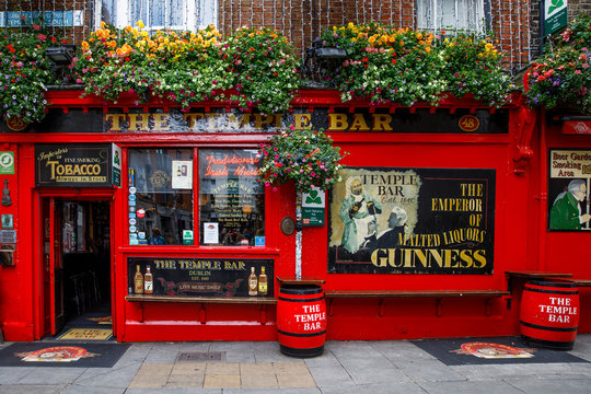 DUBLIN, IRELAND - JULY 1, 2019: Temple Bar is a famous landmark in Dublins cultural quarter visited by thousands of tourists every year. The Temple Bar in the center of the Irish capital