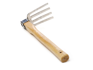 Gardening tools . Gardening rake. Gardening trowel.Metal rake for gardening on white background.