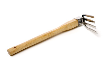 Gardening tools . Gardening rake. Gardening trowel.Metal rake for gardening on white background.