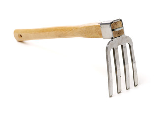 Gardening tools . Gardening rake. Gardening trowel.Metal rake for gardening on white background.