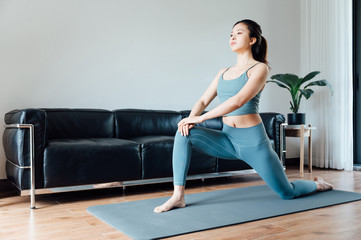 young asian beauty woman doing yoga at home