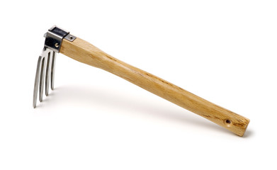 Gardening tools . Gardening rake. Gardening trowel.Metal rake for gardening on white background.