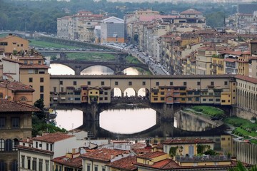 Fototapeta na wymiar View of the Ponte Vecchio in the city of Florence Italy from above at sunset.
