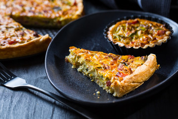 Quiche Lorraine - traditional French tart with pastry crust, bacon and leek