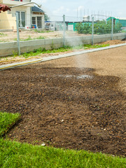 Preparing and watering sod for the new lawn