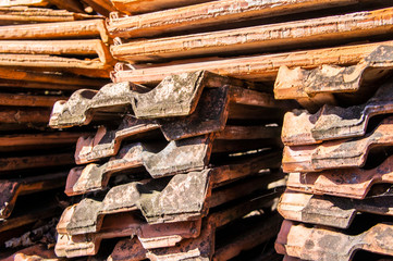 Old red roof tiles closeup. Macro photo.