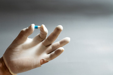 Hand and medicine Antiretroviral drug concept.