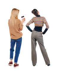 Back view of two woman in sweater.