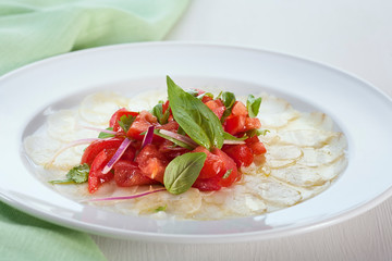 fish and vegetable carpaccio on a light background