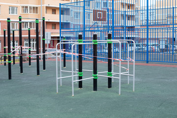 Street sports complex wrapped in striped red white tape. Sanitization of the local area, prevention...