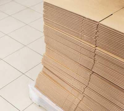 A stack of sheets of industrial packaging board. Cardboard Sheets for Boxes, copy space, industrial, carton