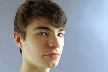 portrait of a young teenage boy with cleft chin