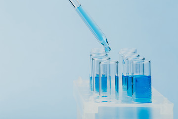 A pipette that adds fluid to one of several tubes. Lab tests