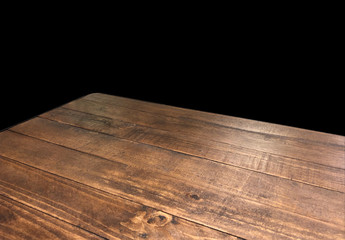 Perspective view of wood or wooden table top corner on black background including clipping path,...