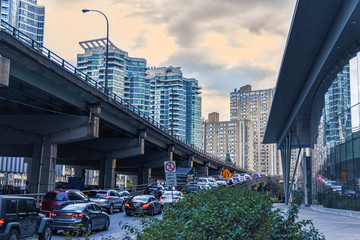 Car traffic jam at the entrance of a freeway in downtown Toronto. City and transport concept....