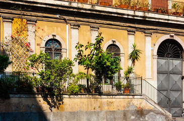 Sicily, facade of old baroque building in Catania, old street with traditional architecture of Italy.