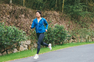 young asian beauty woman running outdoors