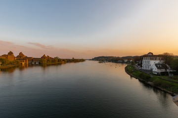 Naklejka premium View on the river Meuse and st Pietersberg (english st Pieters mountain) in Maastricht during sunset. The river is often used for water recreation