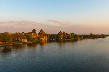 View on the river Meuse and Maastricht landscape with a view on St Pietersberh and Gouvernement building during sunset in april
