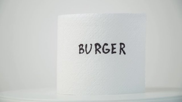 Toilet paper with text budrger. Concept of personal hygiene. Fast food Concept