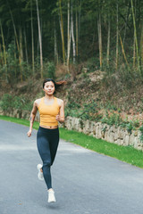 young asian beauty woman running outdoors