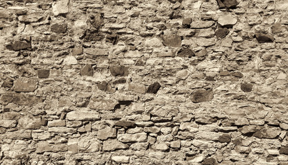 Ancient wall with stones, cobblestones and bricks
