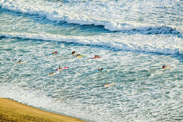 White surf and beach where surfer school sets out for surfing in Durban, South Africa on the Indian Ocean
