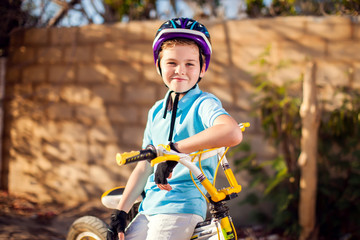 Kid boy with a bicycle. Childhood, leasure and lifestyle concept