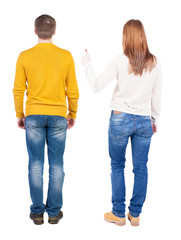 Back view of couple in sweater showing thumbs up.