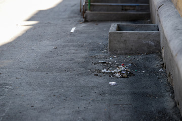 Disgusting waste dumped on public lawn, foreign bin dumped on street, environmental pollution,...
