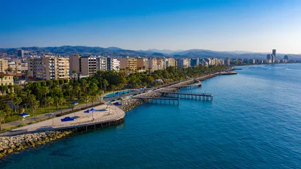 Foto auf Leinwand Cyprus. Limassol. Wooden embankment. Panorama of the Cyprus coast. Resorts of the Mediterranean Sea. Summer vacation in Limassol. Embankment against the blue sky. Beaches of Cyprus. Island Cruises © Grispb