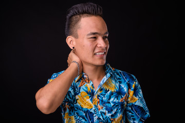 Portrait of young handsome Indian tourist man