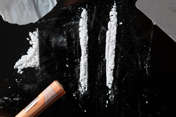 Two Cocaine lines prepared on a table - obrazy, fototapety, plakaty