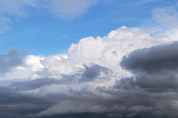Naklejka na ściany i meble Epic dramatic Storm sky, dark and white big cumulus clouds on blue sky background texture 