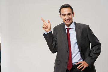 young businessman pointing at you