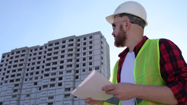 Civil engineer checking work for communication to management team in the construction site