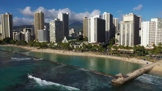 Backwards Moving aerial shot, View offshore of Waikiki Beach Hawaii.