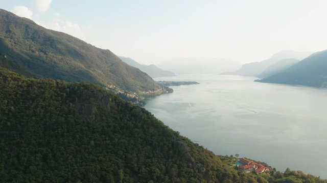 Panoramic view of Como Lake. The lake surrounded by mountains, Italy.