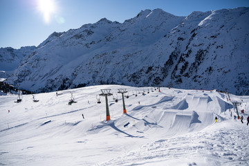 Snowpark in St.Anton am Arlberg on a sunny day. - obrazy, fototapety, plakaty